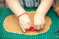 Kids hands making dough cookies