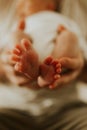 Close up of kids legs in mom`s hands. Tenderness. Family concept Royalty Free Stock Photo