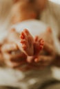 Close up of kids legs in mom`s hands. Tenderness. Family concept Royalty Free Stock Photo