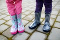 Close up of kids legs in wellington boots