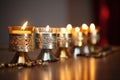 close-up of a kinara holder with candles of differing heights