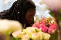 Close up of kind woman that smelling roses Royalty Free Stock Photo