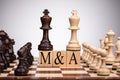 Chess Wooden Blocks With Mergers And Acquisitions Text