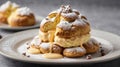 Close up of King profiterole with custard sprinkled with powdered sugar served on a white plate