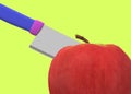 Close up of a kitchen knife slicing a red apple against a luminous green backdrop