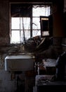 Close up of kitchen left in appalling condition in derelict 1930s deco house. Rayners Lane, Harrow UK