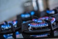 Close-up kitchen stove cook with blue flames burning