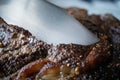 Close-up of a Knife cutting Holiday Prime Rib Roast cut of beef Royalty Free Stock Photo