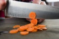 Close Up of Knife Slicing Carrots