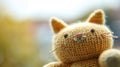 A close up of a knitted cat toy with its eyes open, AI