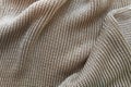 Close-up knitted golden silk fabric. Texture abstract background pattern Royalty Free Stock Photo