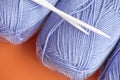 Close-up, knitting texture. Ball of violet thread and knitting needles. Royalty Free Stock Photo