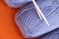 Close-up, knitting texture. Ball of violet thread and knitting needles. Royalty Free Stock Photo