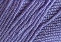 Close-up, knitting texture. The violet thread and knitting.