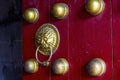 Close-up of the knocker of an ancient Chinese big wooden door Royalty Free Stock Photo