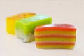 Close-up of Kueh Lapis, a steamed layer cake, with other colorful traditional Peranakan Straits Chinese Nyonya snacks Royalty Free Stock Photo