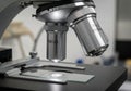 Of a laboratory microscope showcasing two objective lenses labeled Royalty Free Stock Photo