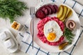 Labskaus, mashed potatoes with the beet, fried egg Royalty Free Stock Photo