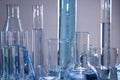 Close up of labware such as beaker, flask, graduated cylinders and test tubes well placed Royalty Free Stock Photo