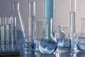 Close up of labware such as beaker, flask, graduated cylinders and test tubes well placed