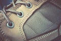 Close up lacing of a brown leather adventure boot