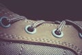 Close up lacing of a brown suede leather adventure boot