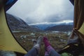 Close up ladies lying in tent in mountain valley concept photo