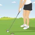 Close up of lady golfer putting. Golf course resort scenes of players and holes Royalty Free Stock Photo