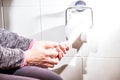 Close-up Of A lady`s Hand Using Toilet Paper Royalty Free Stock Photo