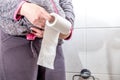 Close-up Of A lady`s Hand Using Toilet Paper Royalty Free Stock Photo