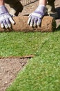 Close Up Of Landscape Gardener Laying Turf For New Lawn Royalty Free Stock Photo