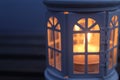 Close up of lantern with candle light inside in the night