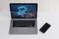 Close up of laptop and cellphone on desktop with digital ruble icon on background. Trade, finance and money concept. 3D Royalty Free Stock Photo