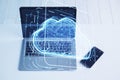 Close up of laptop with cloud computing hologram on blurry office desktop background with cellphone. Data storage and server