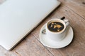 Close up of laptop and coffee cup with world map Royalty Free Stock Photo