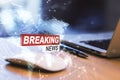 Close up of laptop and computer mouse on desk with creative polygonal hi-tech breaking news hologram on blurry background. Royalty Free Stock Photo