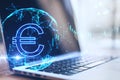 Close up of laptop with creative glowing euro and globe hologram on blurry background. Currency, online banking and market concept Royalty Free Stock Photo