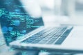 Close up of laptop on desk with creative coding html language on blurry background. Web developer and programming concept. Double