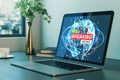 Close up of laptop on desk with different objects and creative polygonal breaking news and globe hologram. Television, online news