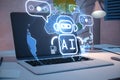 Close up of laptop on desk with lamp, supplies and creative glowing robot and globe ai hologram on blurry background. Machine