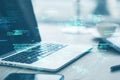 Close up of laptop on desk with supplies and creative coding html language on blurry background. Web developer and programming
