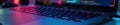 Close up laptop keyboard, code visible on screen , programming, design