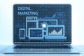 Close up of laptop monitor with creative blue gadgets and business chart hologram on blurry pixel background. Digital marketing,