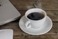 Close up laptop, mouse coffee on wood table. Laptop, mouse, black coffee on wood background coffee concept Royalty Free Stock Photo