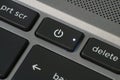 Close up of laptop power button with illuminated LED. Royalty Free Stock Photo