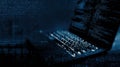 Close-up View of a Laptop Screen Displaying a Complex Matrix of Code in a Deep Blue Tint With a Black Overlay Royalty Free Stock Photo