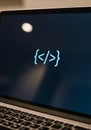 Close-up of a laptop screen displaying a pair of HTML tags with Royalty Free Stock Photo