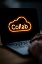 Close-up of a Laptop Screen With a Glowing Cloud Icon and Collab Text, Collaboration Concept Royalty Free Stock Photo