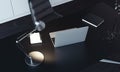 Close up of laptop, lamp and notepad on the table, 3d rendering. Royalty Free Stock Photo