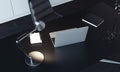 Close up of laptop, lamp and notepad on the table, 3d rendering.